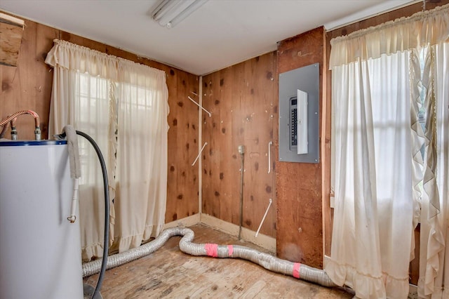 2514 Lumpkin Rd, Augusta, GA 30906 - misc room featuring electric panel, wood walls, gas water heater, and wood finished floors