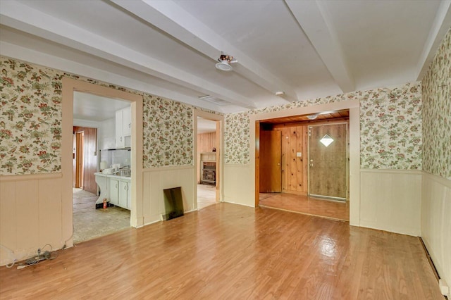 2514 Lumpkin Rd, Augusta, GA 30906 - empty room featuring beam ceiling, wainscoting, wood finished floors, and wallpapered walls