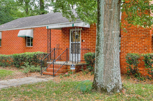 2514 Lumpkin Rd, Augusta, GA 30906 - view of front facade featuring a shingled roof and brick siding