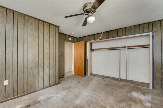 2514 Lumpkin Rd, Augusta, GA 30906 - unfurnished bedroom featuring wooden walls, carpet floors, ceiling fan, and a closet