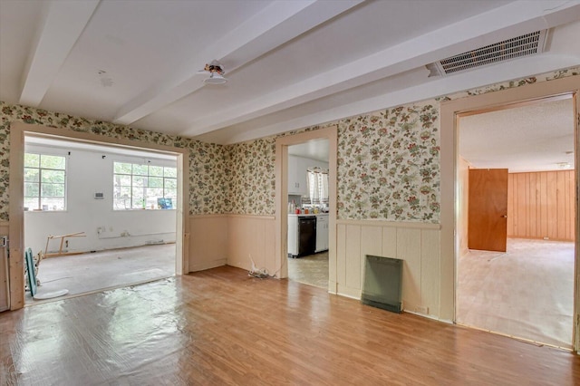2514 Lumpkin Rd, Augusta, GA 30906 - empty room featuring visible vents, a ceiling fan, beam ceiling, light wood finished floors, and wainscoting