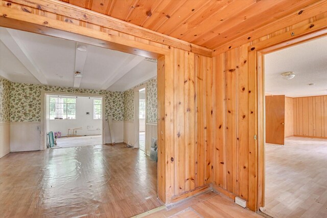 2514 Lumpkin Rd, Augusta, GA 30906 - empty room featuring light wood-style floors, wallpapered walls, wood walls, and wainscoting