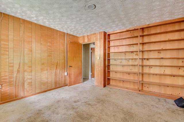 2514 Lumpkin Rd, Augusta, GA 30906 - unfurnished bedroom featuring carpet flooring, a textured ceiling, and wooden walls