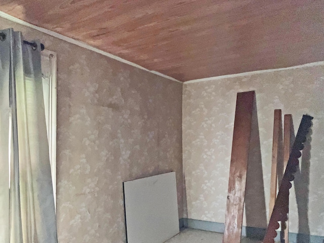 interior details with wood ceiling and ornamental molding
