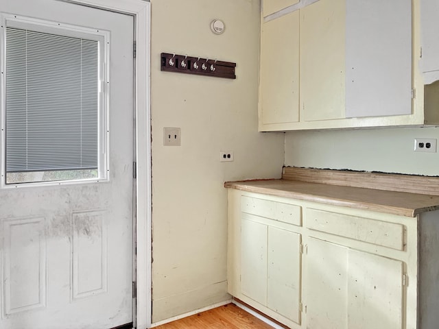 washroom featuring light wood-style floors and hookup for an electric dryer
