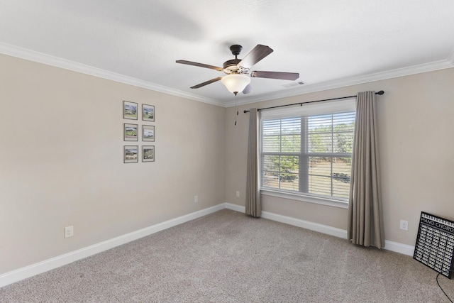 empty room featuring ornamental molding, light colored carpet, visible vents, and baseboards