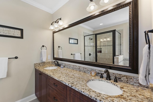 full bath featuring crown molding, a stall shower, and a sink