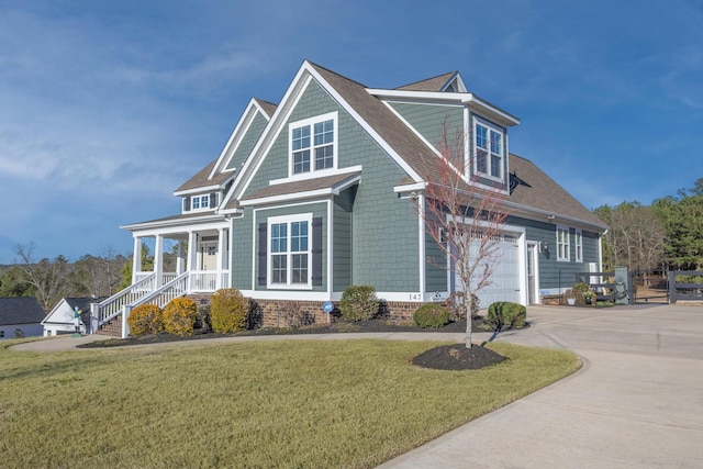 view of front of property featuring concrete driveway, a front lawn, roof with shingles, and an attached garage