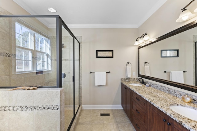 full bathroom featuring crown molding, a sink, and a shower stall