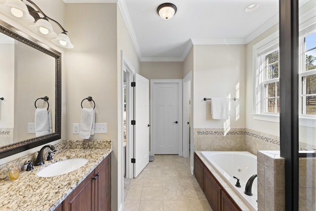 bathroom with tile patterned flooring, a tub with jets, crown molding, and vanity