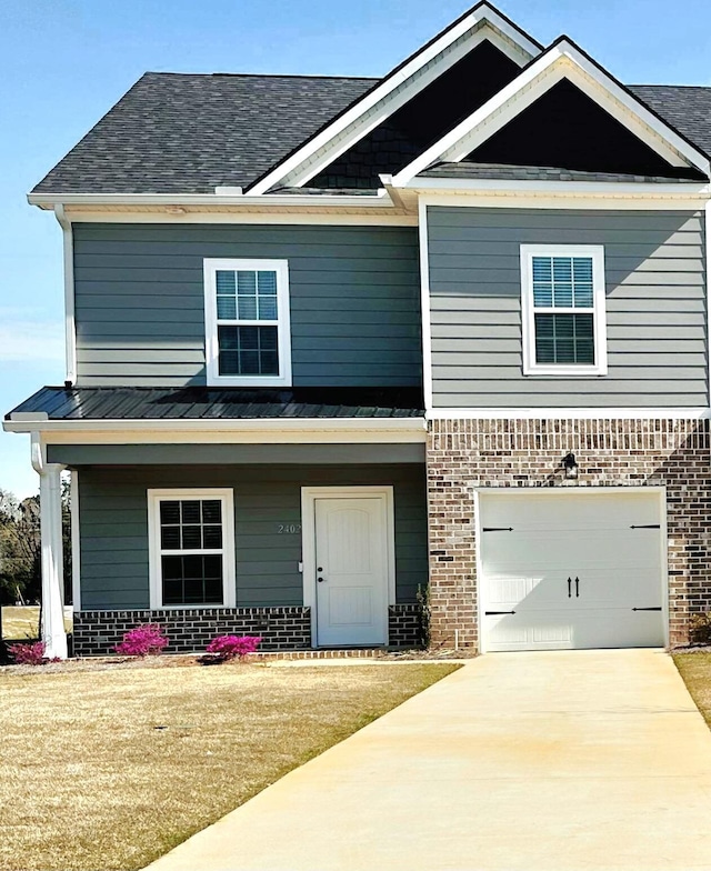 craftsman house featuring a garage and a front lawn