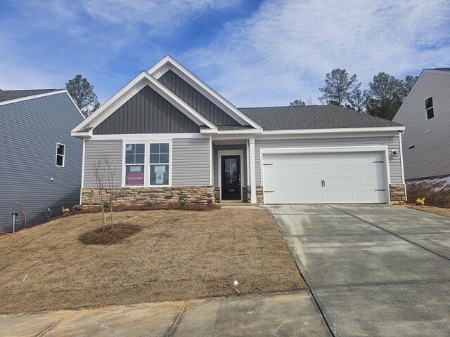 craftsman-style house with a garage and a front yard