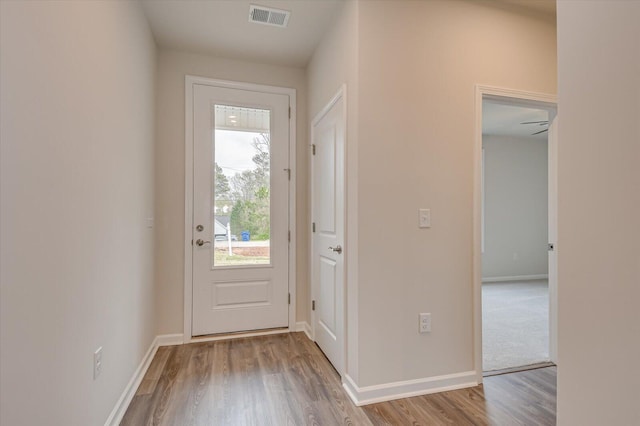 doorway to outside featuring light hardwood / wood-style floors and ceiling fan