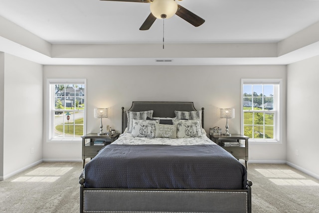 4136 Buffalo Trl, Evans, GA 30809 - carpeted bedroom with a tray ceiling and ceiling fan