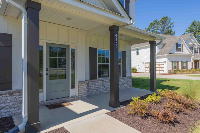 4136 Buffalo Trl, Evans, GA 30809 - entrance to property with covered porch, board and batten siding, and stone siding