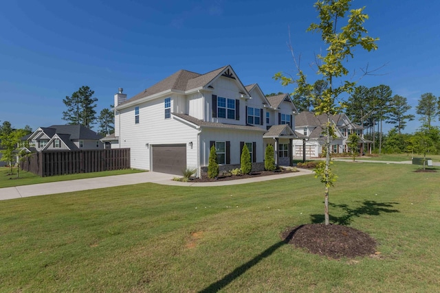 4136 Buffalo Trl, Evans, GA 30809 - view of front facade featuring a garage, concrete driveway, board and batten siding, and a chimney