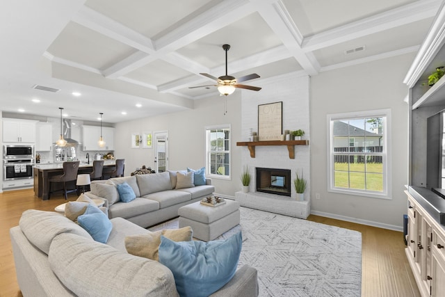 4136 Buffalo Trl, Evans, GA 30809 - living area with coffered ceiling, wood finished floors, beam ceiling, ceiling fan, and a fireplace