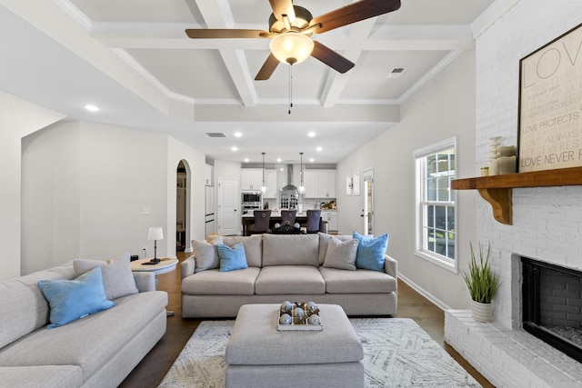 4136 Buffalo Trl, Evans, GA 30809 - living room featuring coffered ceiling, dark wood-style floors, ceiling fan, a fireplace, and beamed ceiling