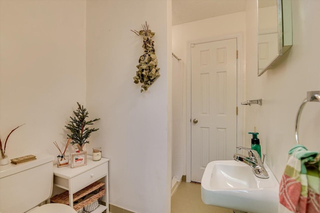 bathroom with toilet and sink