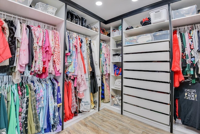 walk in closet featuring light hardwood / wood-style floors