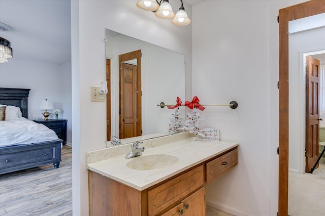 bathroom with vanity and wood-type flooring