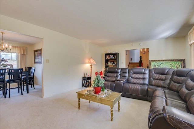 living room with light carpet and an inviting chandelier