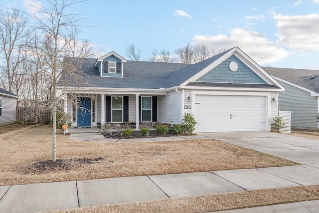 view of front of house with a porch and a garage