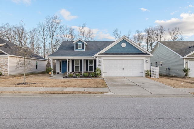 view of front of home with covered porch and a garage