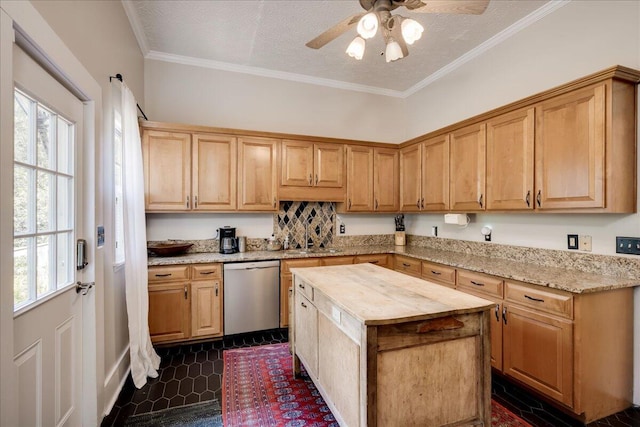 kitchen with dishwasher, wood counters, a kitchen island, crown molding, and a sink