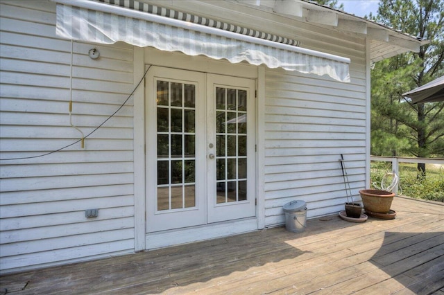 entrance to property with french doors and a deck