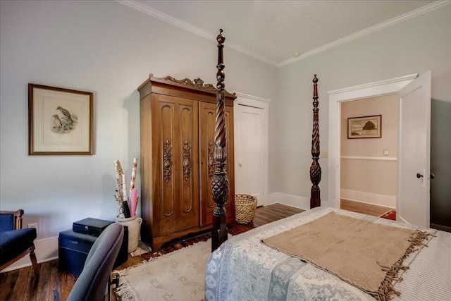 bedroom featuring dark wood-style floors, baseboards, and ornamental molding