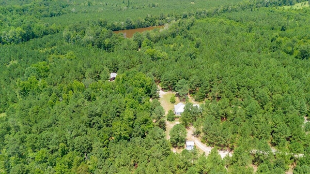 drone / aerial view featuring a wooded view