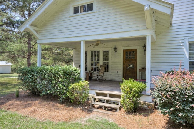 entrance to property with a ceiling fan