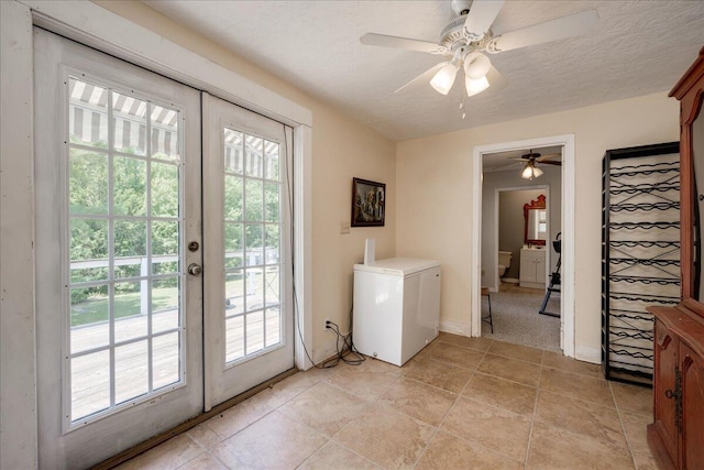 doorway featuring stairway, french doors, a textured ceiling, and baseboards