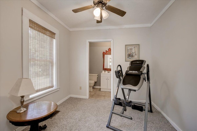 workout area featuring light carpet, baseboards, ornamental molding, and ceiling fan