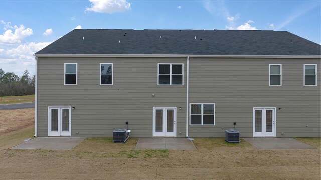 back of property featuring french doors, central AC, and a patio area