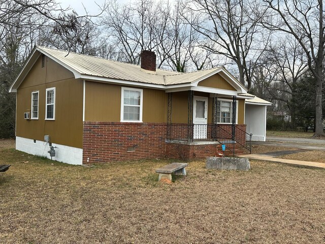 view of front of home with a carport