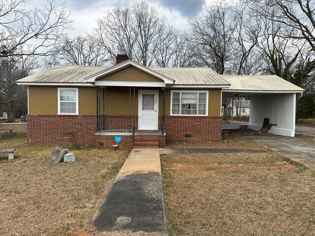 view of front of home with a carport