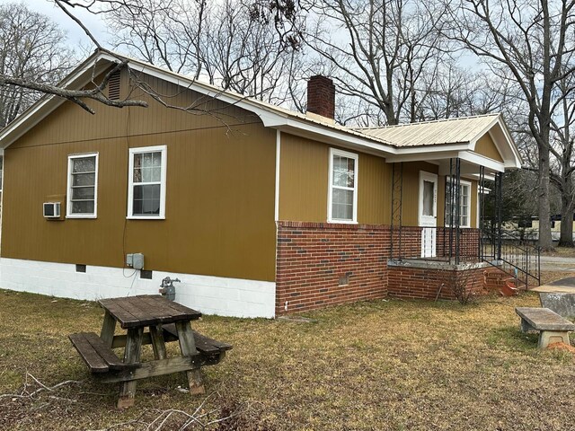 back of property with covered porch