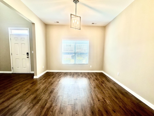 unfurnished dining area with dark hardwood / wood-style floors