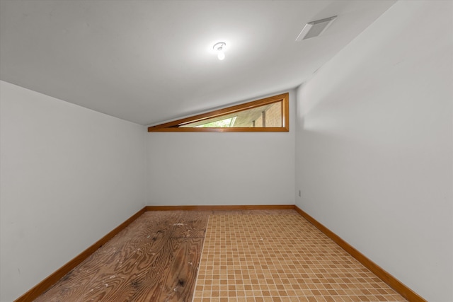 additional living space with lofted ceiling