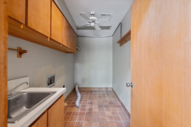 laundry room with hookup for a washing machine, ceiling fan, sink, and cabinets