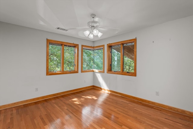 unfurnished room featuring light hardwood / wood-style floors and ceiling fan