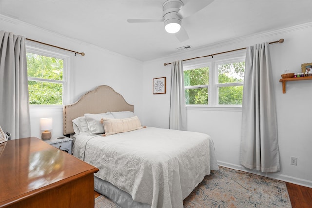 2219 Vireo Dr, North Augusta, SC 29841 - bedroom featuring multiple windows, wood finished floors, crown molding, and ceiling fan