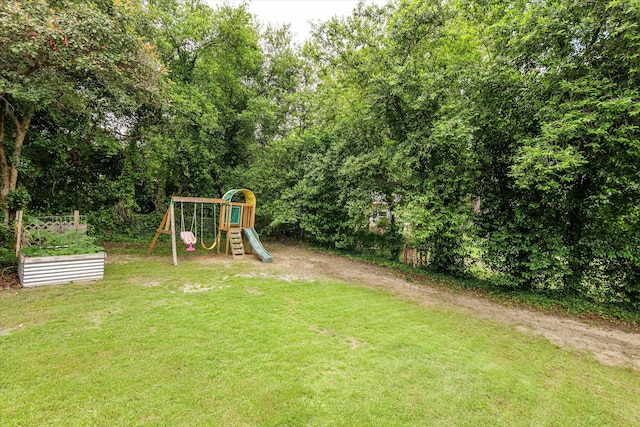 2219 Vireo Dr, North Augusta, SC 29841 - view of grassy yard with a playground and a garden