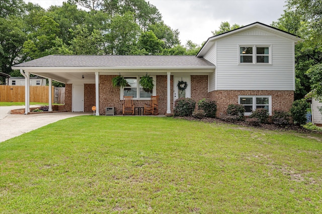 2219 Vireo Dr, North Augusta, SC 29841 - tri-level home with brick siding, covered porch, driveway, and a carport
