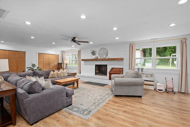 2219 Vireo Dr, North Augusta, SC 29841 - living room with recessed lighting, a ceiling fan, light wood-style flooring, and a fireplace