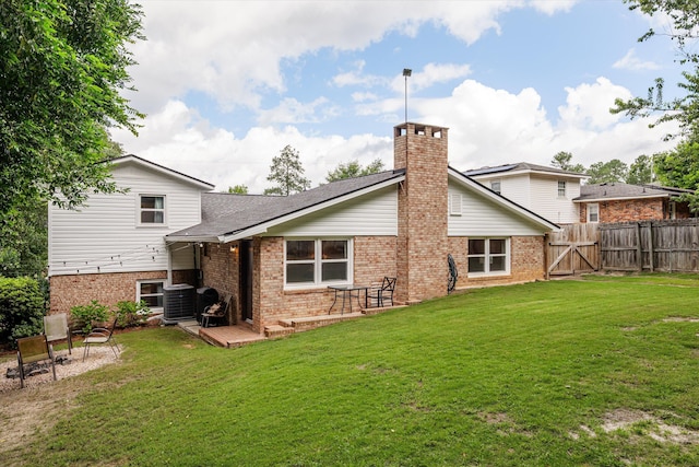 2219 Vireo Dr, North Augusta, SC 29841 - back of property featuring brick siding, a chimney, a gate, a deck, and roof with shingles