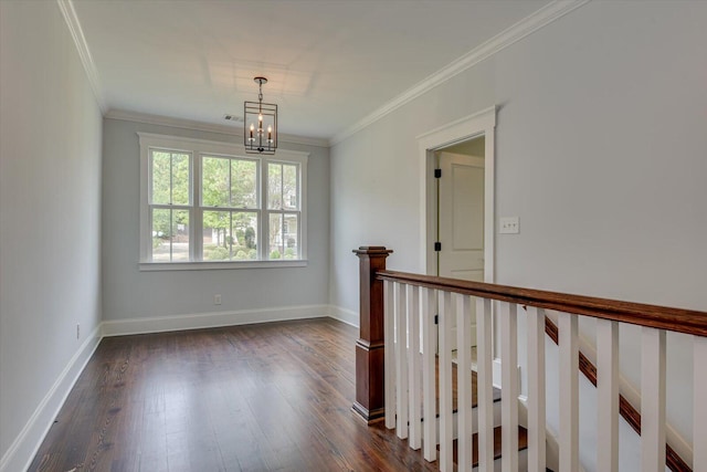 hall featuring ornamental molding, dark hardwood / wood-style floors, and a notable chandelier