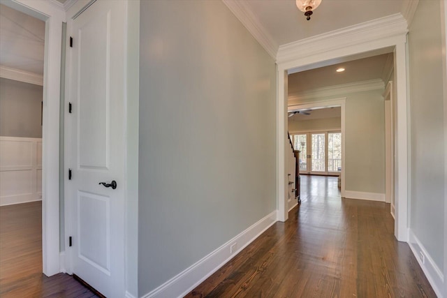 hallway with crown molding and dark wood-type flooring